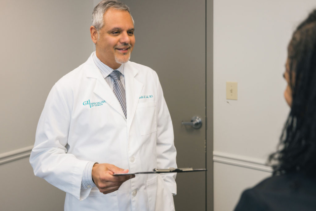 A doctor converses with a woman in a hallway in Atlanta, GA