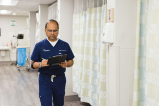GI Specialists team member candid photo going for a discussion with patient