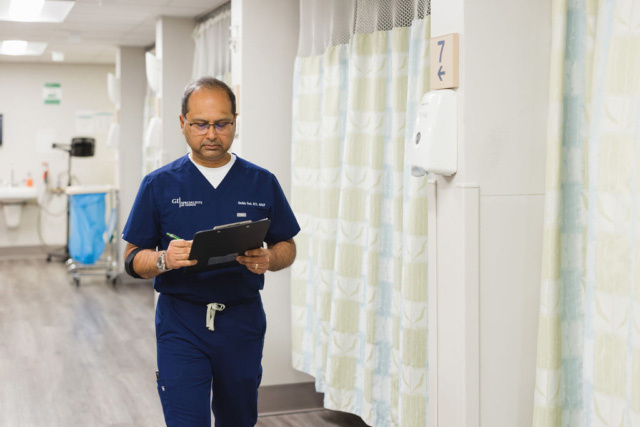 GI Specialists team member candid photo going for a discussion with patient