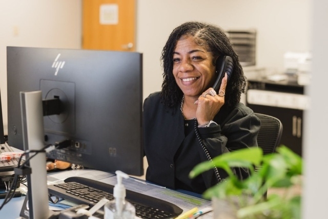 person-working-at-desk A Person at GI Specialists of Georgia is Speaking with a Patient via Telephone in Atlanta, GA