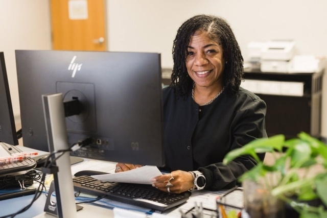 person-working-at-desk_1 A Person Working at a Desk and Holding Papers at a GI Center in Atlanta, GA